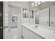 Bathroom features a double sink vanity, modern fixtures and bright lighting at 1243 Williamswood Pointe, Decatur, GA 30033