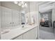 Well-lit bathroom with large mirror, modern vanity, and access to the bedroom at 1243 Williamswood Pointe, Decatur, GA 30033