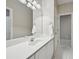 Bright bathroom featuring a modern vanity with a large mirror and updated fixtures at 1243 Williamswood Pointe, Decatur, GA 30033
