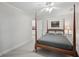 Bedroom with four poster bed, neutral colors, and carpeted floors at 1243 Williamswood Pointe, Decatur, GA 30033