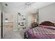 Bedroom with a unique bookshelf and comfortable bed with a patterned quilt at 1243 Williamswood Pointe, Decatur, GA 30033