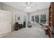 Bedroom with natural light, carpet flooring and a gray armchair at 1243 Williamswood Pointe, Decatur, GA 30033