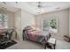 Cozy bedroom with a vintage-style bed and a window providing natural light at 1243 Williamswood Pointe, Decatur, GA 30033
