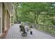 Back deck with comfortable seating offering a view of trees and greenery at 1243 Williamswood Pointe, Decatur, GA 30033
