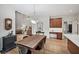 Open dining area with hardwood floors and a view into the living area at 1243 Williamswood Pointe, Decatur, GA 30033