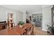 Elegant dining room with a wooden table, chairs, hardwood floors and a view into the living room at 1243 Williamswood Pointe, Decatur, GA 30033