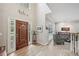 Spacious foyer featuring a high ceiling, wooden door and hardwood flooring at 1243 Williamswood Pointe, Decatur, GA 30033
