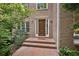 Inviting brick home entrance featuring an ornate front door and brick steps at 1243 Williamswood Pointe, Decatur, GA 30033