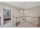 Hallway with carpet flooring and wood railing at 1243 Williamswood Pointe, Decatur, GA 30033