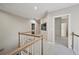 Hallway featuring carpet flooring, neutral walls and wood railing at 1243 Williamswood Pointe, Decatur, GA 30033