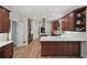 Spacious kitchen featuring rich wood cabinets, stainless steel appliances, and white countertops at 1243 Williamswood Pointe, Decatur, GA 30033
