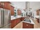 Spacious kitchen featuring stainless steel appliances, a center island cooktop, and hardwood flooring at 1243 Williamswood Pointe, Decatur, GA 30033
