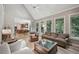 Spacious living room open to the kitchen, with a deck view at 1243 Williamswood Pointe, Decatur, GA 30033