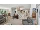 Bright living room with hardwood floors, piano, comfortable seating, and a view to the dining room at 1243 Williamswood Pointe, Decatur, GA 30033