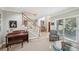 Bright living room with large windows, hardwood floors, and elegant furnishings at 1243 Williamswood Pointe, Decatur, GA 30033