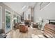 Bright living room with high ceilings, a fireplace, and large windows at 1243 Williamswood Pointe, Decatur, GA 30033