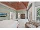 Large main bedroom with sitting area, wood ceiling, and ample natural light at 1243 Williamswood Pointe, Decatur, GA 30033
