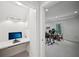 Office space featuring a built-in desk, lighting, and doorway to music room at 1243 Williamswood Pointe, Decatur, GA 30033
