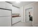 Pantry with white cabinets, countertops, and refrigerator at 1243 Williamswood Pointe, Decatur, GA 30033
