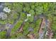 Aerial view of community pool and common areas surrounded by mature trees, walkable from townhomes at 203 Bridge Se Ln, Smyrna, GA 30082