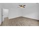 This bright bedroom features wood-look flooring, fresh paint, and a ceiling fan at 203 Bridge Se Ln, Smyrna, GA 30082