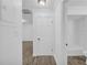 Hallway leading to the bathroom, bedroom, and living spaces, with wood-look flooring at 203 Bridge Se Ln, Smyrna, GA 30082
