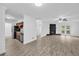 Open floor plan includes kitchen, dining area, and living room with fireplace and French doors at 203 Bridge Se Ln, Smyrna, GA 30082