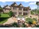 Brick home featuring a backyard hot tub with two Adirondack chairs for relaxing poolside at 341 Carl Sanders Dr, Acworth, GA 30101