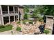 Beautiful backyard stone patio with lounge chairs and lush greenery at 341 Carl Sanders Dr, Acworth, GA 30101