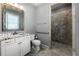 Modern bathroom with a walk-in shower, granite countertops, and sleek fixtures at 341 Carl Sanders Dr, Acworth, GA 30101