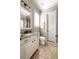 Elegant bathroom with granite countertops, custom vanity, and tiled floors at 341 Carl Sanders Dr, Acworth, GA 30101