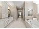 Elegant bathroom features a soaking tub, granite countertops, and custom cabinetry at 341 Carl Sanders Dr, Acworth, GA 30101