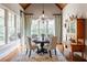 Bright breakfast nook with large windows, wooden floor, and comfortable seating at 341 Carl Sanders Dr, Acworth, GA 30101