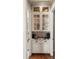 Butler's Pantry with custom glass door cabinets, stone countertops, and modern appliances at 341 Carl Sanders Dr, Acworth, GA 30101