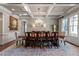 Elegant dining room with coffered ceiling, chandelier, and classic decor offers a refined space for entertaining at 341 Carl Sanders Dr, Acworth, GA 30101
