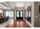 Elegant foyer boasts hardwood floors, transom windows, and decorative lighting at 341 Carl Sanders Dr, Acworth, GA 30101