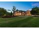 Lovely dusk photo of landscaped home exterior, showing yard, walkway, and home lighting at 341 Carl Sanders Dr, Acworth, GA 30101