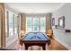 Bright game room featuring a pool table, natural light, and elegant decor at 341 Carl Sanders Dr, Acworth, GA 30101