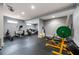 Home gym featuring various exercise machines and equipment on black rubber flooring at 341 Carl Sanders Dr, Acworth, GA 30101