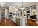 Gourmet kitchen with custom cabinets, granite countertops, stainless steel appliances and modern lighting at 341 Carl Sanders Dr, Acworth, GA 30101