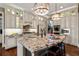 Gourmet kitchen with custom cabinets, granite countertops, stainless steel appliances and modern lighting at 341 Carl Sanders Dr, Acworth, GA 30101