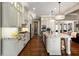 Spacious kitchen with custom cabinets, granite countertops, stainless steel appliances and modern lighting at 341 Carl Sanders Dr, Acworth, GA 30101