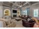 Cozy living room featuring a fireplace, built-in shelving and coffered ceilings at 341 Carl Sanders Dr, Acworth, GA 30101