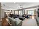 Expansive living room flowing into kitchen, featuring a pool table and comfortable seating at 341 Carl Sanders Dr, Acworth, GA 30101