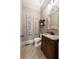 Stylish powder room featuring a decorative mirror, granite countertop, and beautiful wall decor at 341 Carl Sanders Dr, Acworth, GA 30101