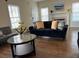 Comfortable living room featuring hardwood floors, neutral paint and large bright windows at 737 Cooper Sw St, Atlanta, GA 30315