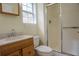 Bathroom featuring a wood vanity, shower, and natural light at 1341 Timbercrest Ct, Lawrenceville, GA 30045