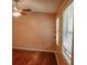 View of a bedroom with hardwood floors, ceiling fan, and natural light at 1341 Timbercrest Ct, Lawrenceville, GA 30045