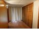 This hallway features wood-look cabinets and wood-look closet doors at 1341 Timbercrest Ct, Lawrenceville, GA 30045