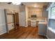 Bright kitchen features stainless steel microwave, wood floors, and classic cabinets at 1341 Timbercrest Ct, Lawrenceville, GA 30045